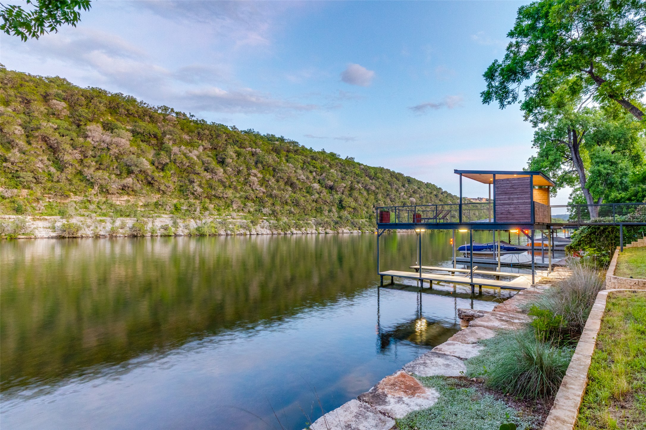 303 Lago Verde Road Austin, TX 78734 - Photo 33 of 39 A stunning private boat dock with a covered upper deck offers direct waterfront access.