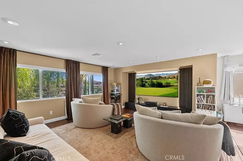 44840 Tudal Street Temecula, CA 92592 - Photo 12 of 35 a living room with furniture and a flat screen tv