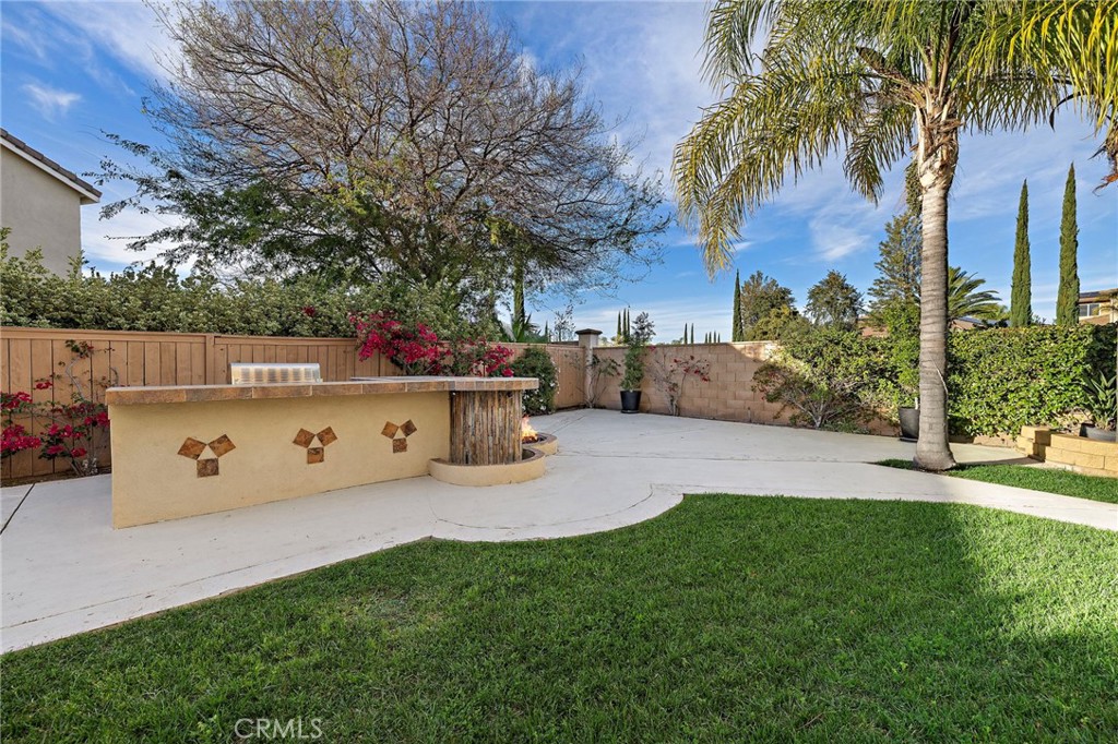44840 Tudal Street Temecula, CA 92592 - Photo 22 of 35 a backyard of a house with table and chairs plants