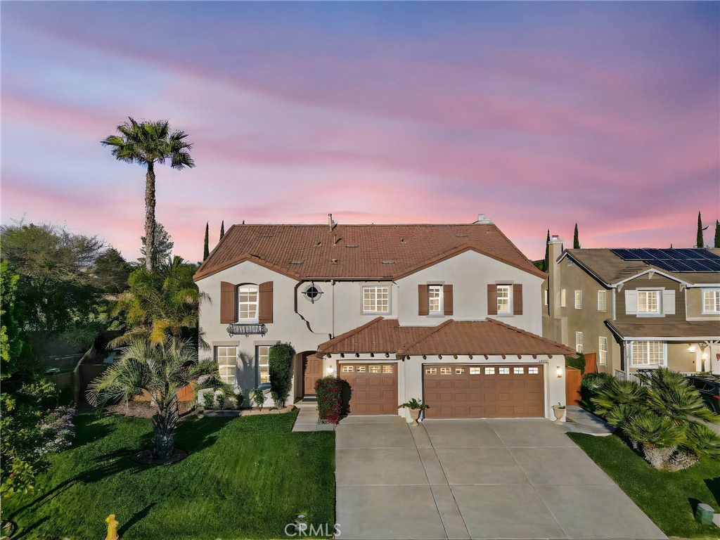 44840 Tudal Street Temecula, CA 92592 - Photo 28 of 35 a front view of a house with a garden