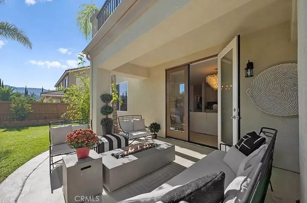 44840 Tudal Street Temecula, CA 92592 - Photo 10 of 35 a view of a patio with couches table and chairs and potted plants