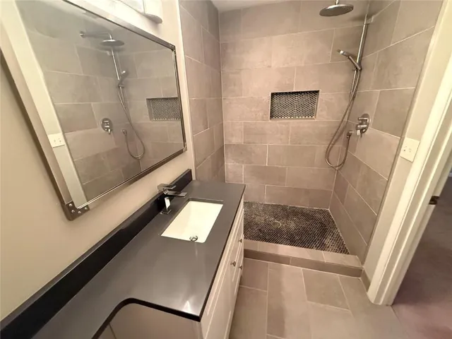 a bathroom with a tub and a shower