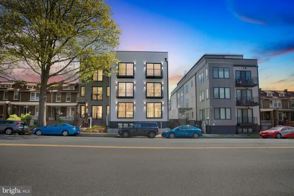a cars parked in front of brick building