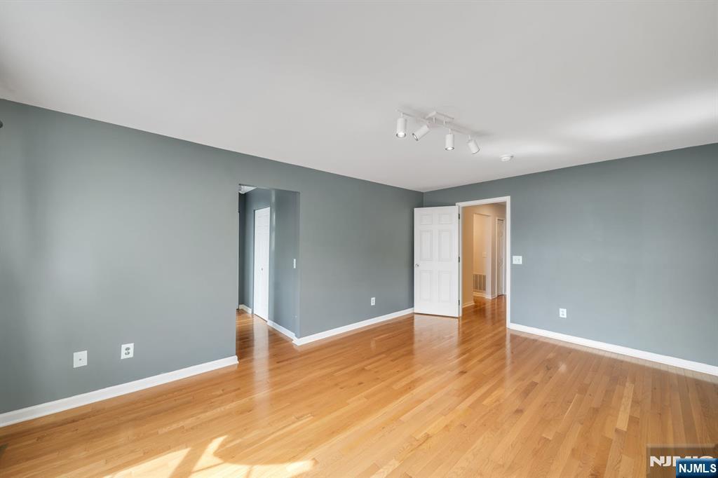 66 Bergen Ridge Road, Unit 1 North Bergen, NJ 07047 - Photo 16 of 26 a view of an empty room with wooden floor