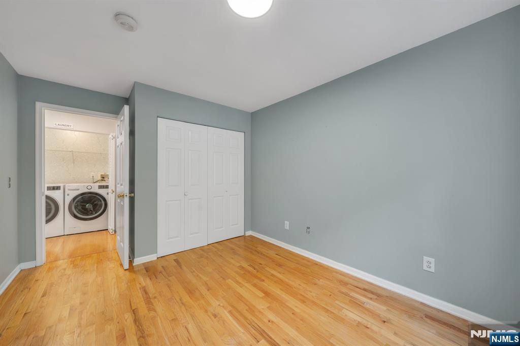 66 Bergen Ridge Road, Unit 1 North Bergen, NJ 07047 - Photo 20 of 26 a view of a room with wooden floor and white walls