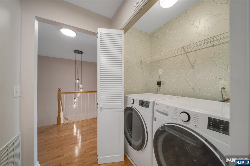 66 Bergen Ridge Road, Unit 1 North Bergen, NJ 07047 - Photo 23 of 26 a view of washer and dryer with kitchen in the background