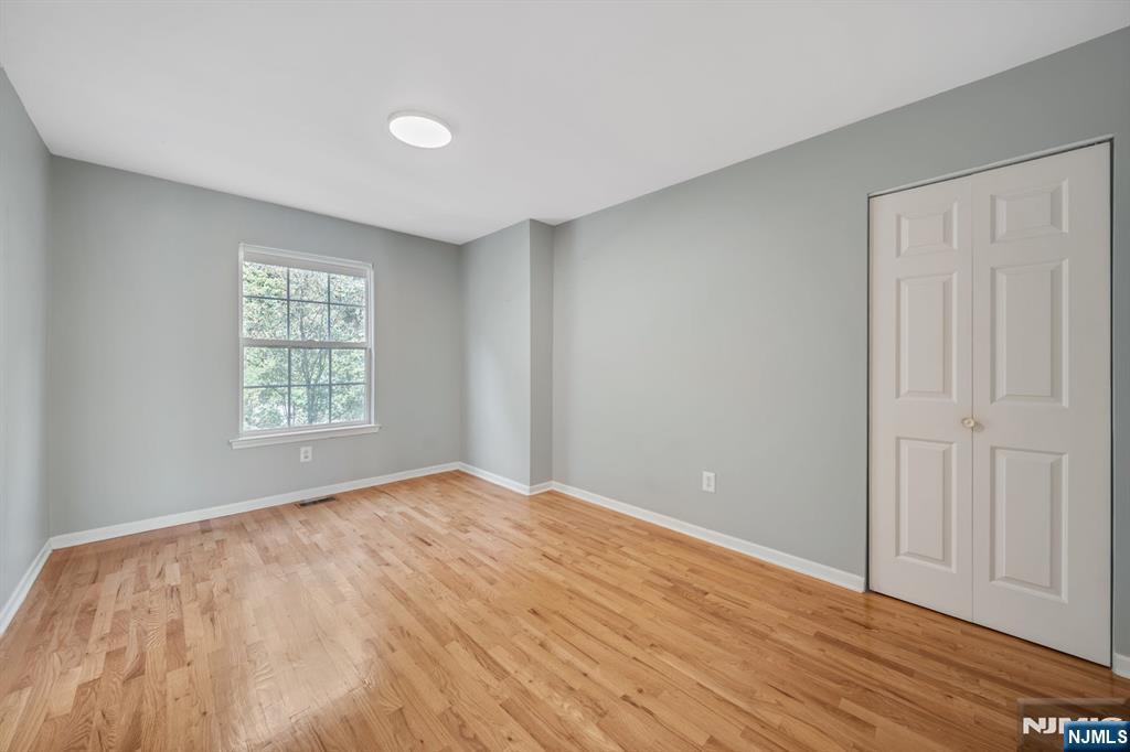 66 Bergen Ridge Road, Unit 1 North Bergen, NJ 07047 - Photo 24 of 26 a view of an empty room with wooden floor and a window