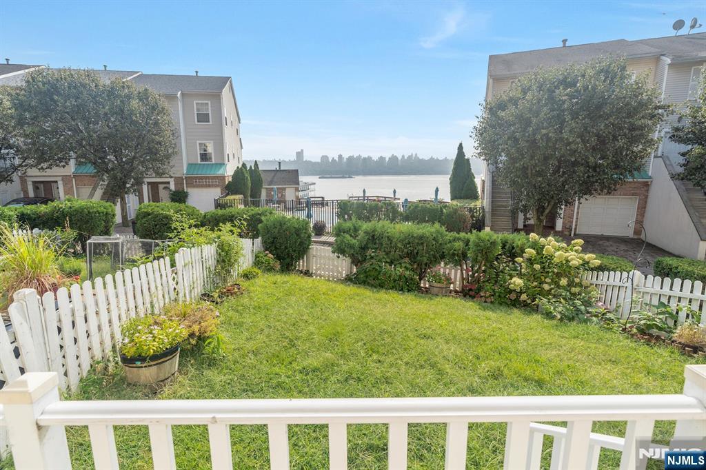 66 Bergen Ridge Road, Unit 1 North Bergen, NJ 07047 - Photo 3 of 26 a view of a garden with a building in the background