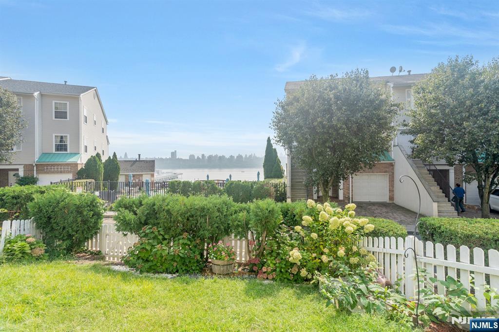 66 Bergen Ridge Road, Unit 1 North Bergen, NJ 07047 - Photo 4 of 26 a view of a house with a yard and plants