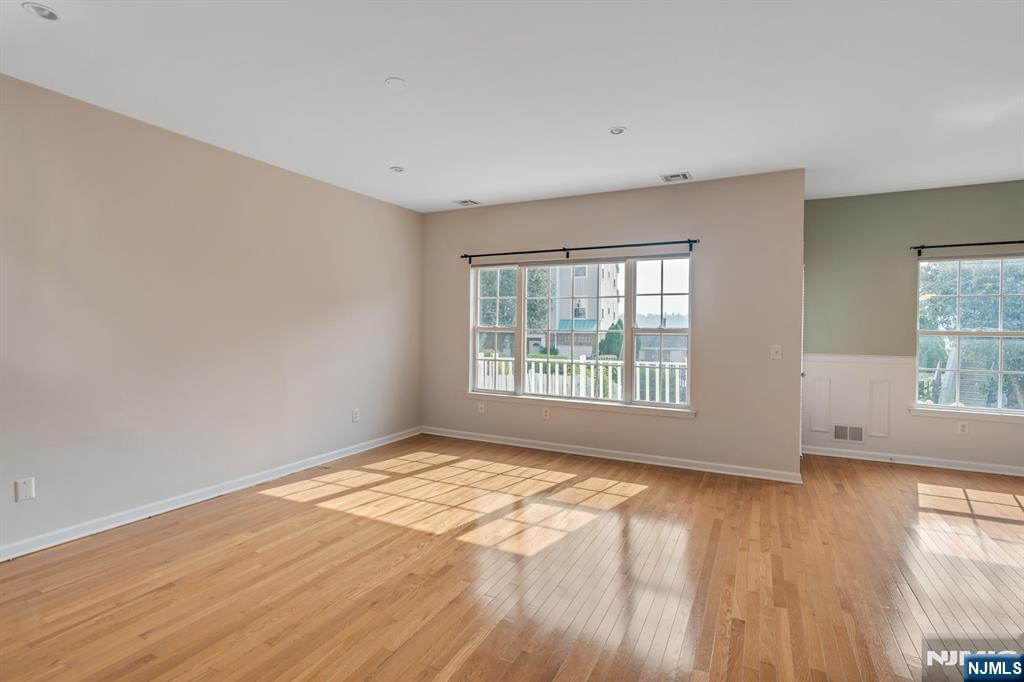 66 Bergen Ridge Road, Unit 1 North Bergen, NJ 07047 - Photo 6 of 26 a view of an empty room with wooden floor and a window
