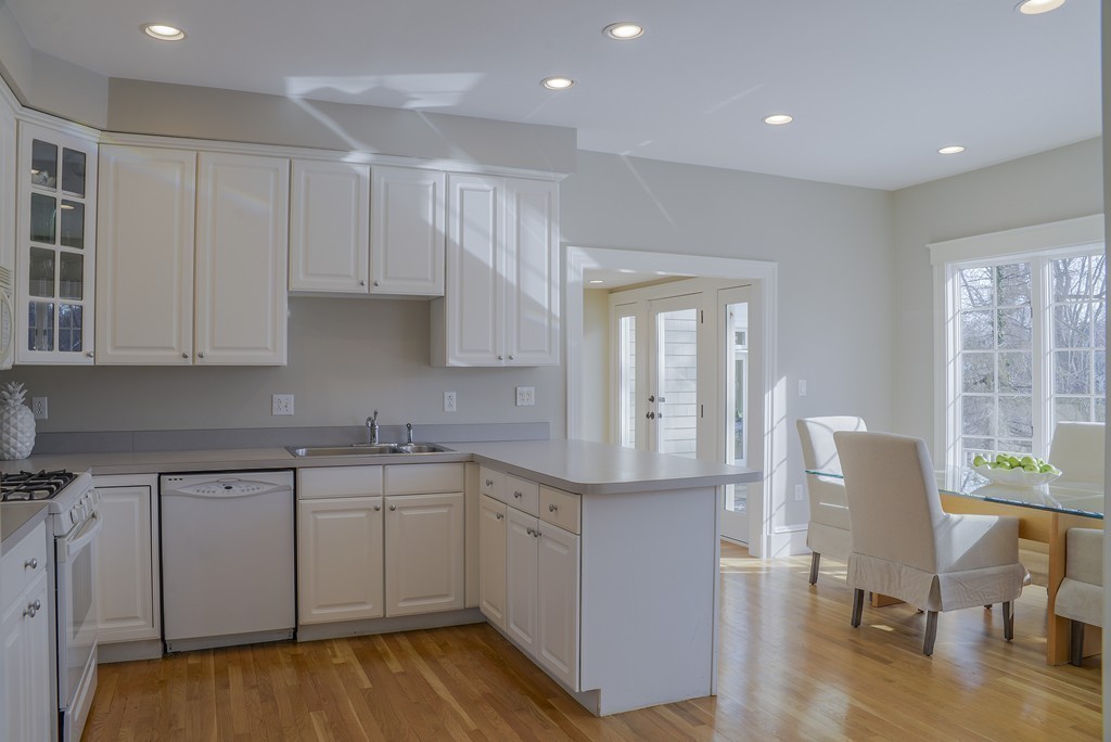16 Winthrop Road Lexington, MA 02421 - Photo 11 of 29 a kitchen with cabinets table and chairs