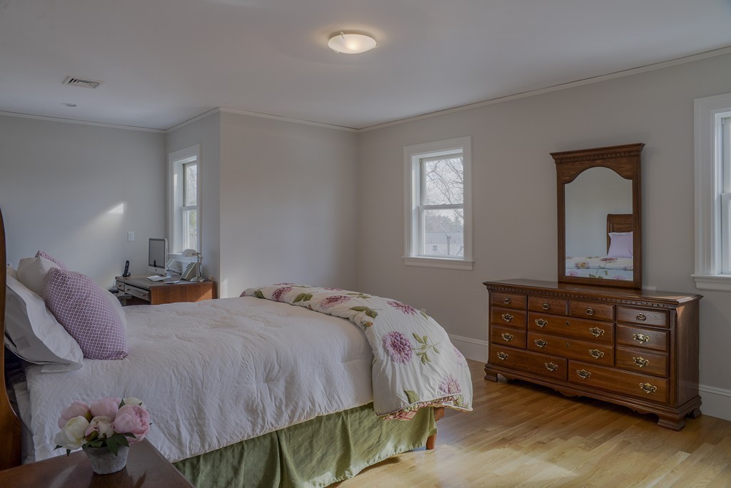 16 Winthrop Road Lexington, MA 02421 - Photo 20 of 29 a bedroom with a bed and a dresser