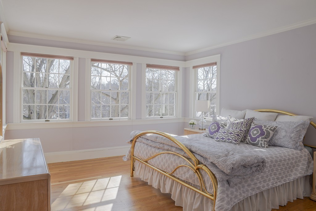16 Winthrop Road Lexington, MA 02421 - Photo 23 of 29 a spacious bedroom with a bed and a large window