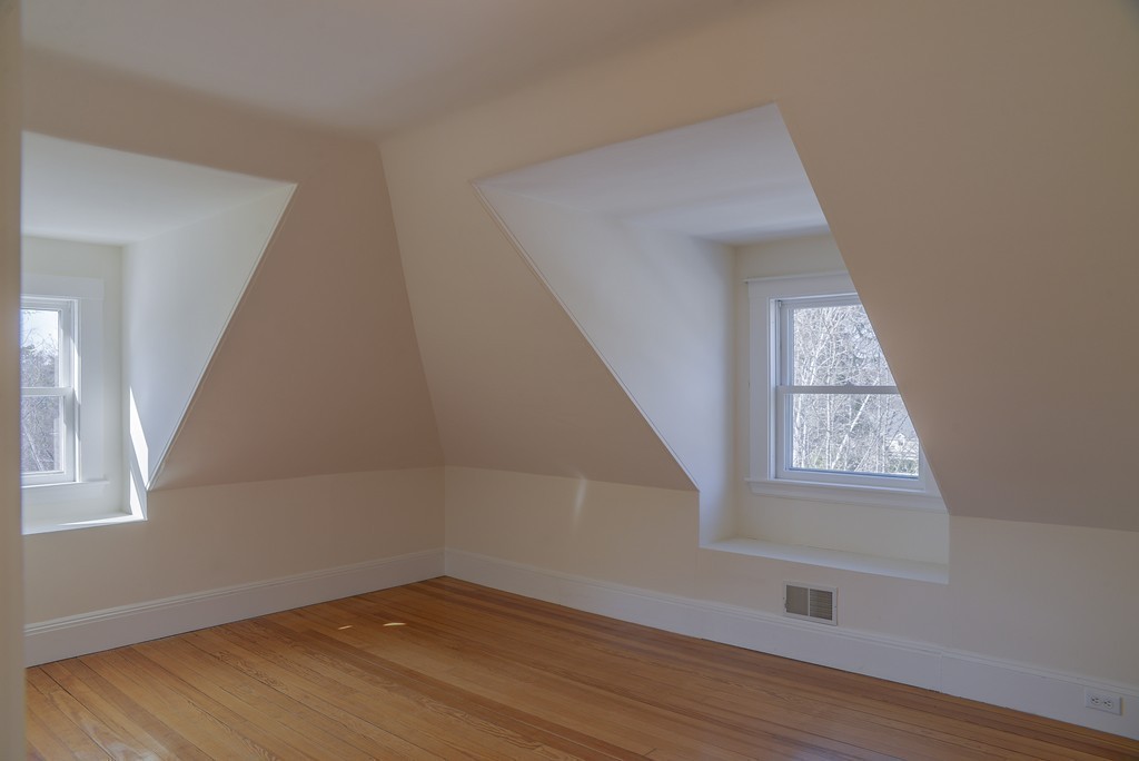 16 Winthrop Road Lexington, MA 02421 - Photo 26 of 29 a view of an empty room with wooden floor and a window