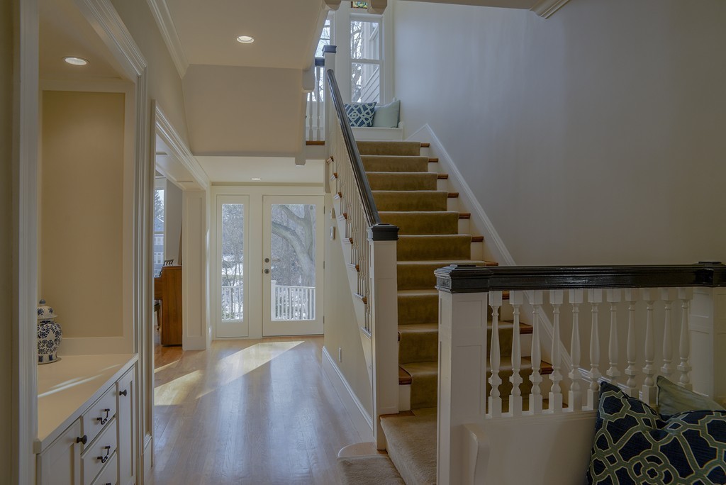 16 Winthrop Road Lexington, MA 02421 - Photo 4 of 29 a view of a hallway with wooden floor and staircase