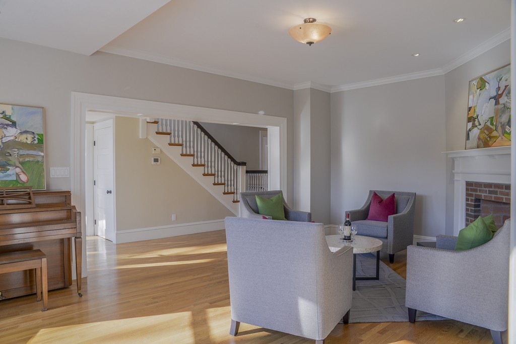 16 Winthrop Road Lexington, MA 02421 - Photo 7 of 29 a living room with furniture and a fireplace