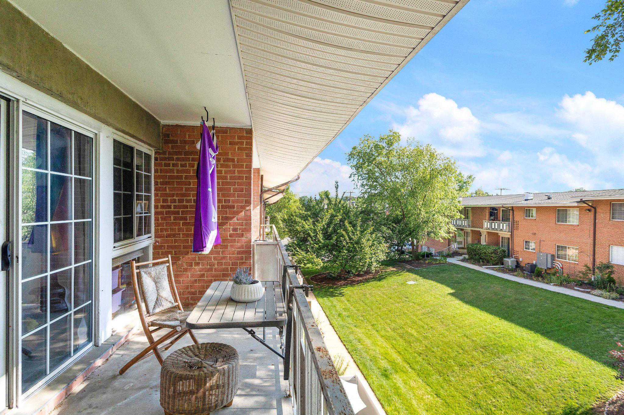 5613 Franconia Road, Unit 303 Alexandria, VA 22310 - Photo 18 of 27 a view of a backyard with sitting area and garden