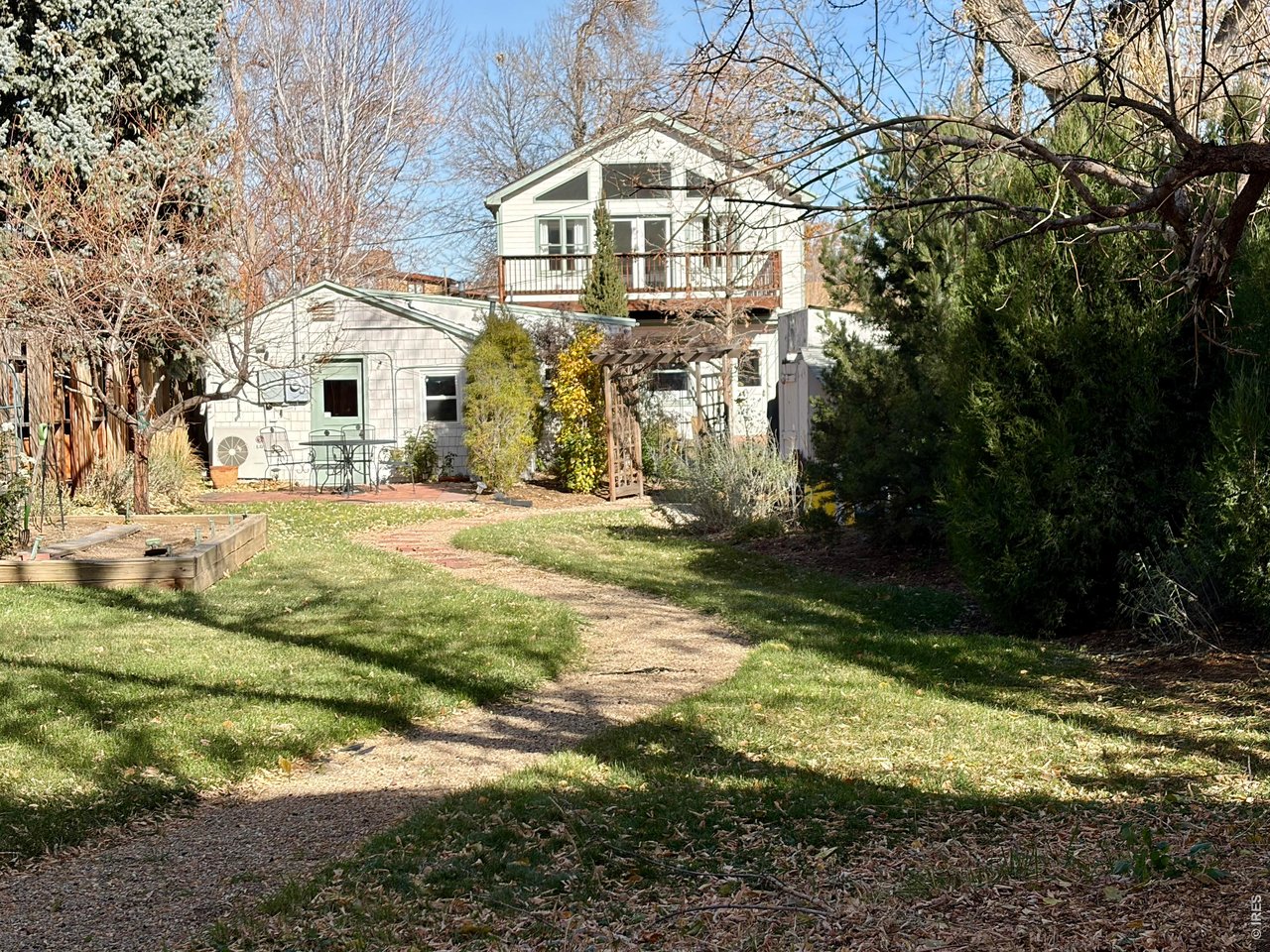 Back on the main home, patio, path and sitting area behind the cottage