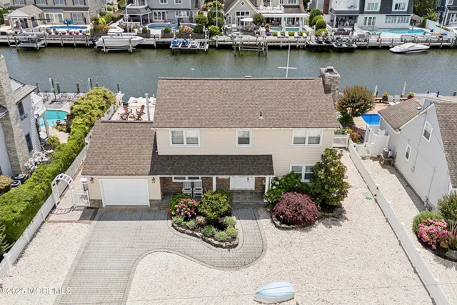 a view of a house with outdoor space and a lake view