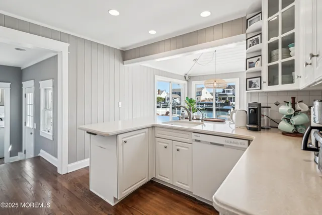 a very nice looking room with wooden floor and furniture