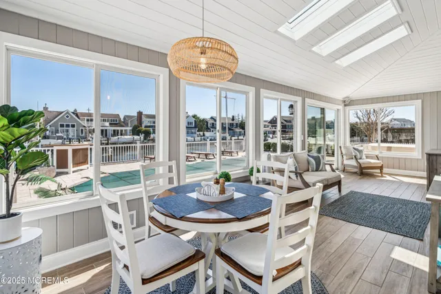 a outdoor space with patio the couches and a dining table with garden view