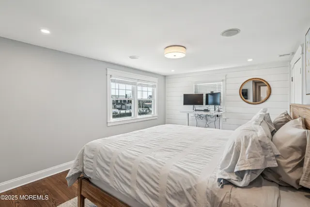 a bedroom with a bed and a chair