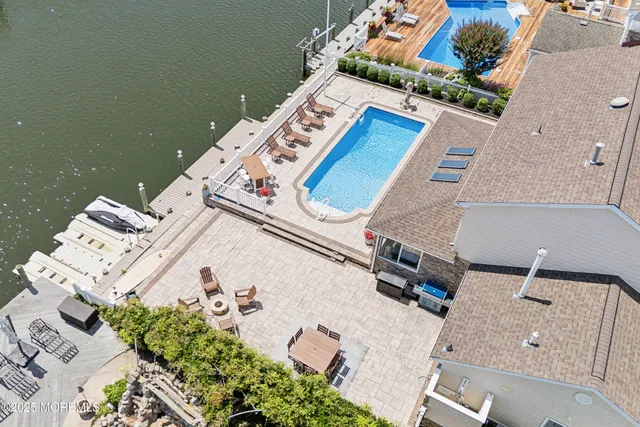 an aerial view of a house with outdoor space