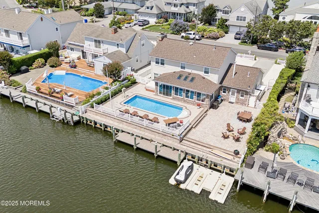 an aerial view of a house with a swimming pool