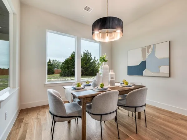 a view of a dining room with furniture window and outside view