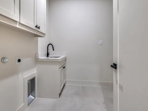 a view of a kitchen with cabinets