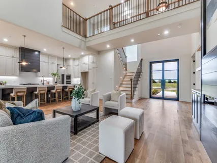 a large kitchen with kitchen island a island a sink a counter space and stainless steel appliances