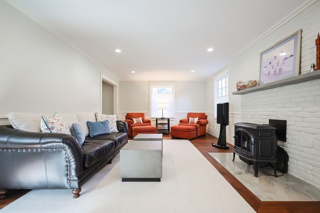 41 Gilbert Road Needham, MA 02492 - Photo 21 of 40 a living room with furniture and a fireplace