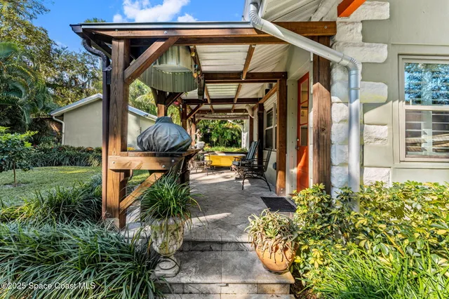 a kitchen with a sink cabinets and wooden floor