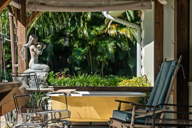 a kitchen with stainless steel appliances granite countertop a stove a sink dishwasher and a refrigerator with wooden floor