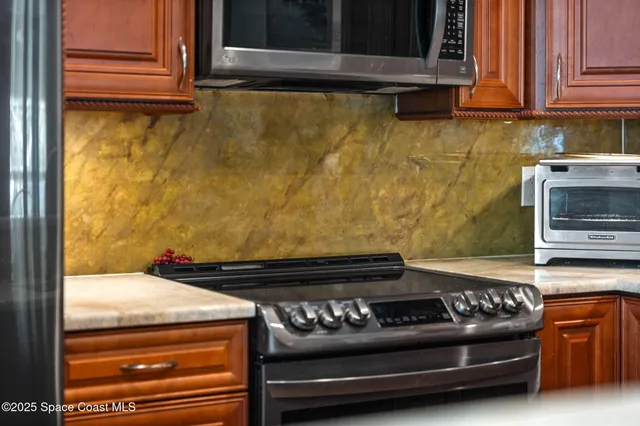 a living room with furniture a rug and a large window