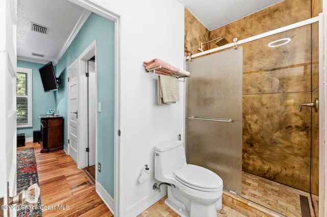a bathroom with a toilet and a sink