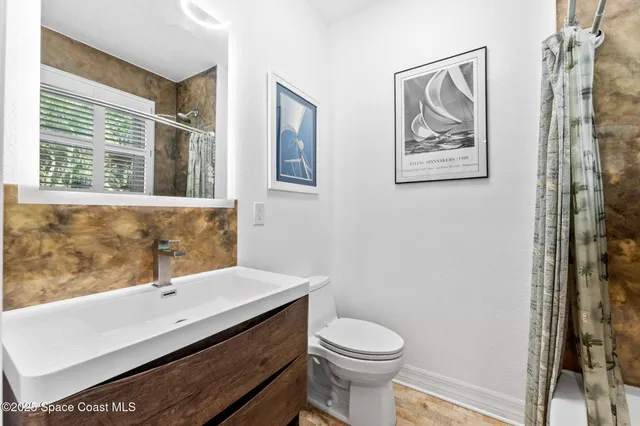 a picture of a bathroom with a sink