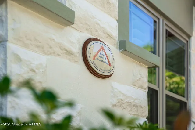 a view of an empty room with a staircase