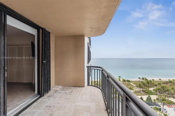 a large kitchen with a table and chairs