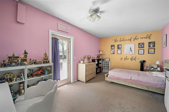 a bedroom with furniture and a window