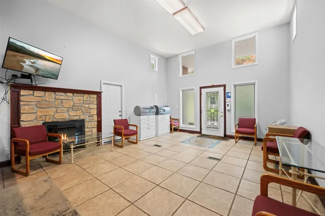 a bedroom with furniture and a fireplace