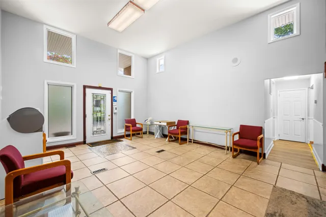 a bedroom with furniture and a chair