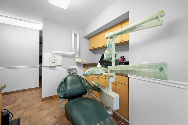 a living room with a sink and furniture