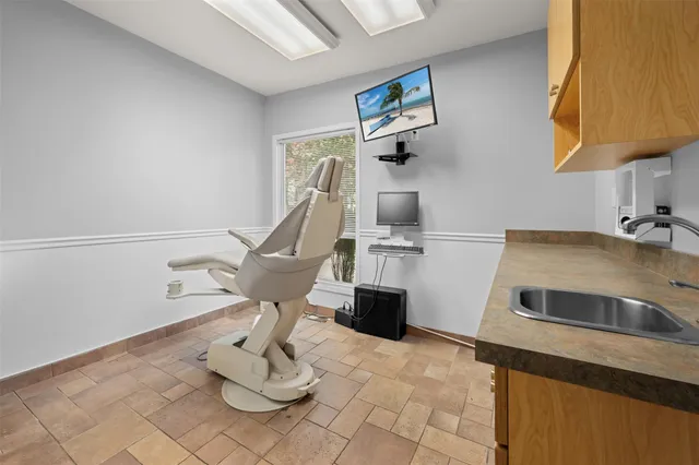 a view of a hallway with seating area