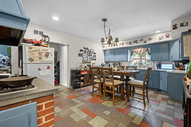 a kitchen with lots of counter top space and appliances