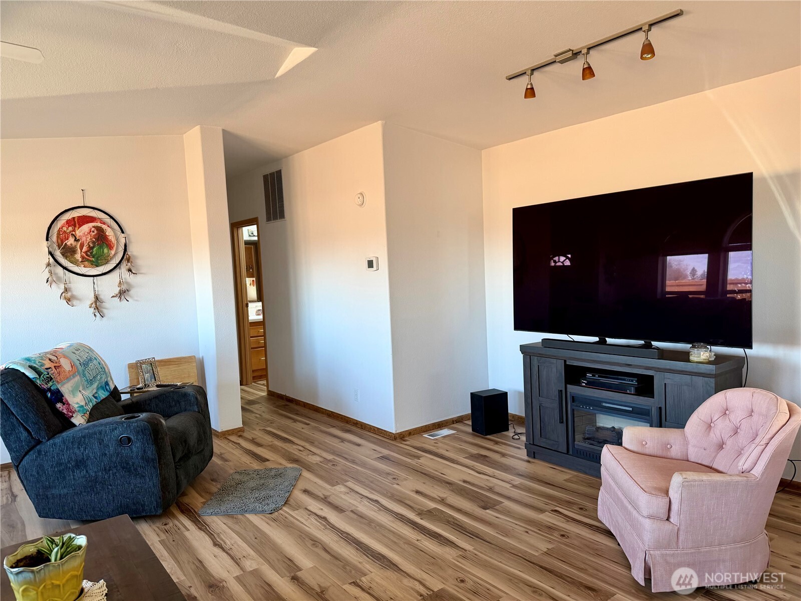 505 Northwest Portland Street Wilbur, WA 99185 - Photo 14 of 40 a living room with furniture and a flat screen tv
