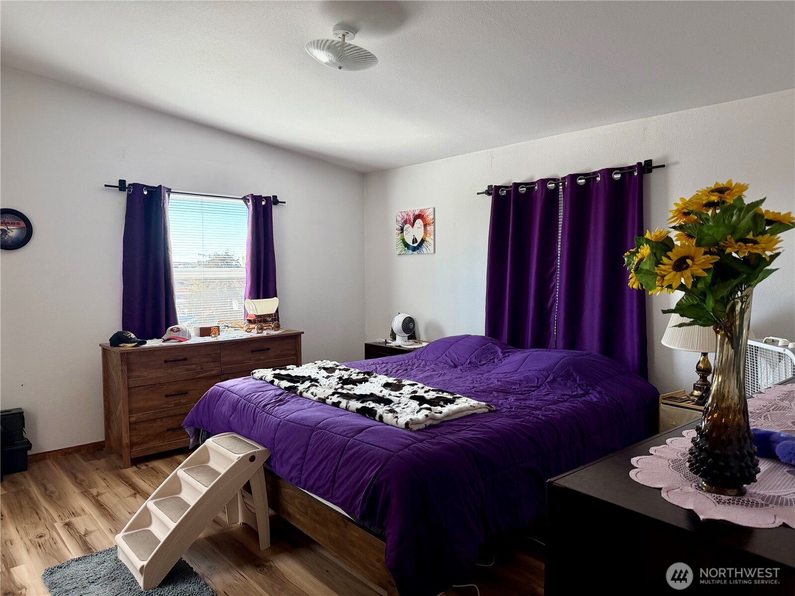 505 Northwest Portland Street Wilbur, WA 99185 - Photo 16 of 40 a bedroom with a bed and a potted plant