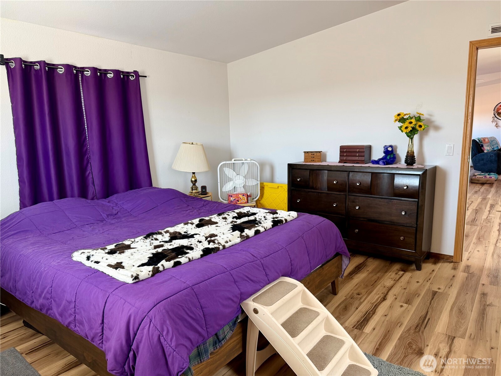 505 Northwest Portland Street Wilbur, WA 99185 - Photo 17 of 40 a bedroom with a bed and a dresser