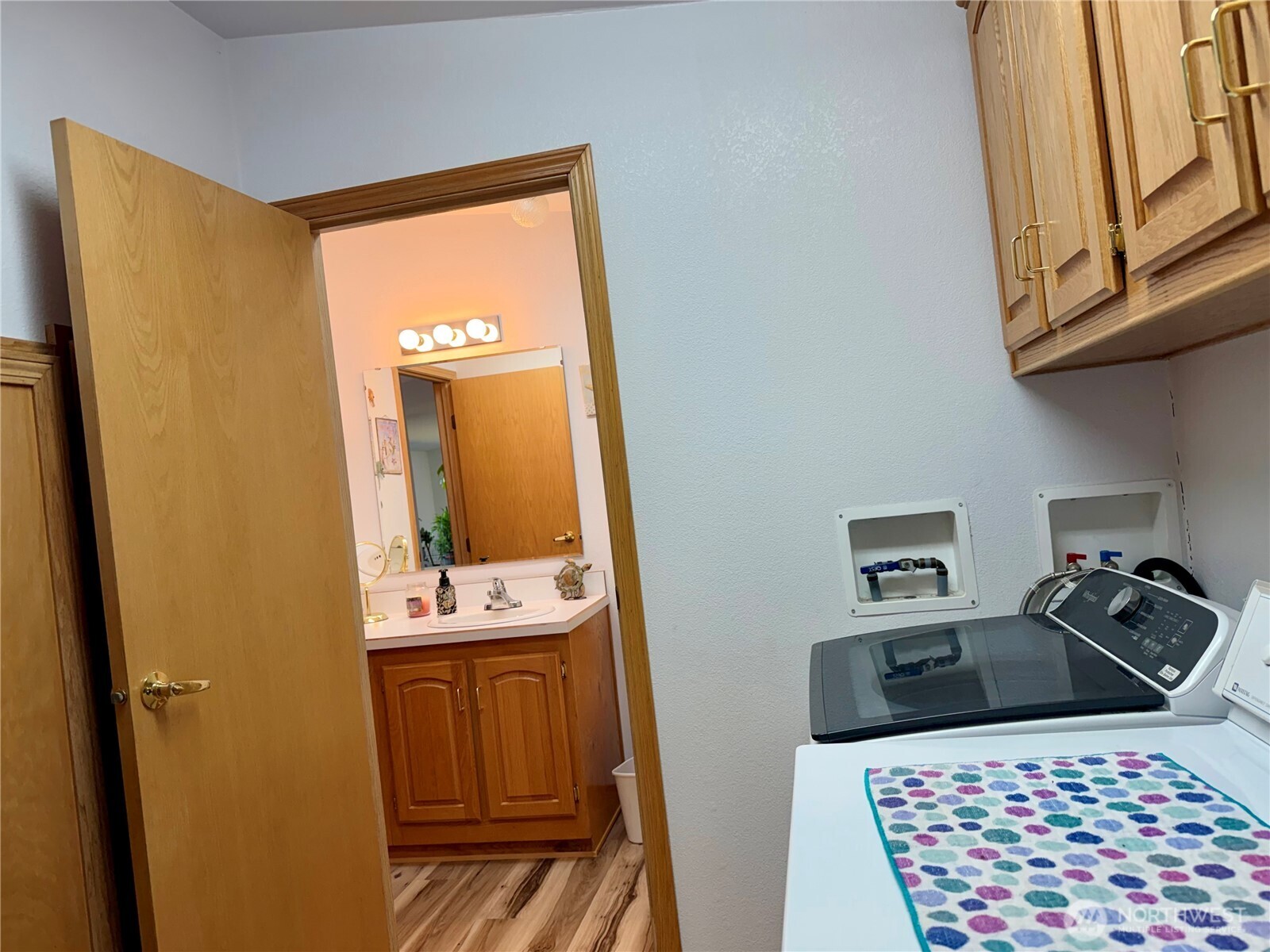 505 Northwest Portland Street Wilbur, WA 99185 - Photo 24 of 40 a bathroom with a sink a mirror and shower