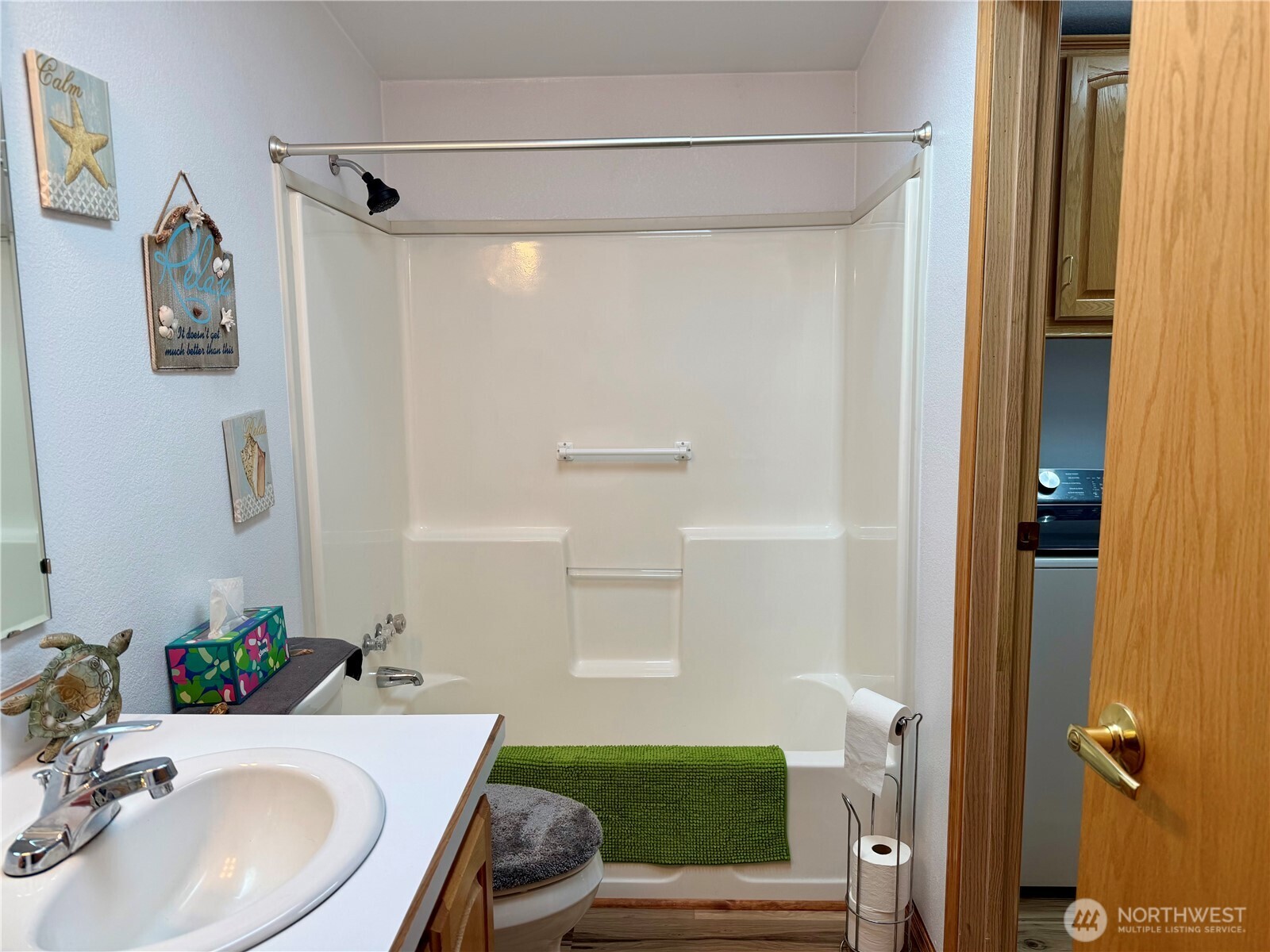 505 Northwest Portland Street Wilbur, WA 99185 - Photo 26 of 40 a bathroom with a sink mirror toilet and shower